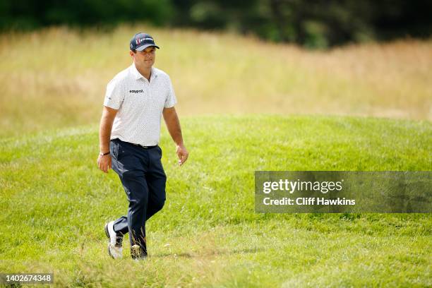 Patrick Reed of the United States walks from the fifth hole to the sixth hole during a practice round prior to the 2022 U.S. Open at The Country Club...