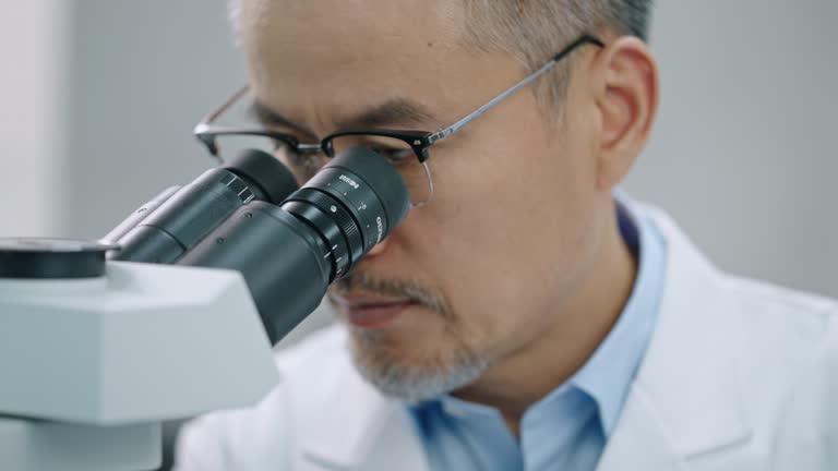 Microscope Man Looking Through Microscope Male Videos and HD Footage - Getty Images