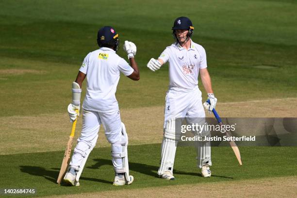 Ben Compton of Kent celebrates his 50 with Daniel Bell-Drummond of Kent during the LV= Insurance County Championship match between Kent and...