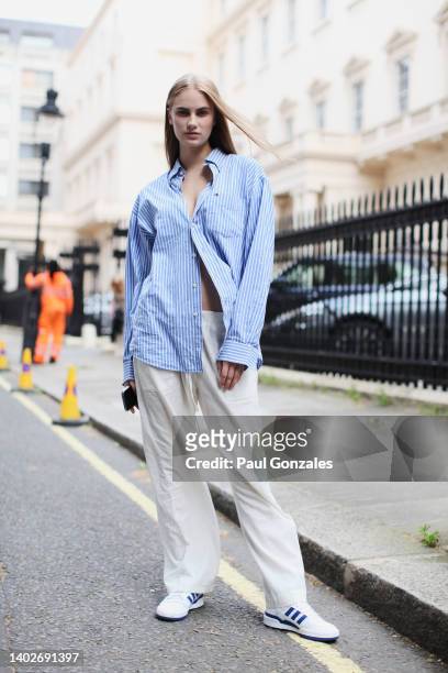Cicely is seen wearing a Baby Blue Pinstripe Shirt at Ravensbourne University London during London Fashion Week on June 11, 2022 in London, England.