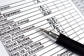 Close up of a report card with a pen