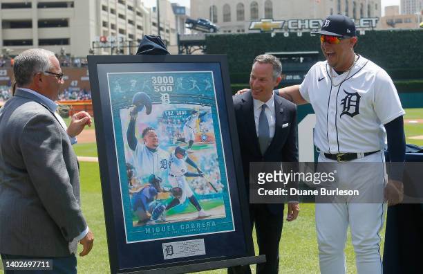 Miguel Cabrera of the Detroit Tigers laughs with Christopher Ilitch, chairman and CEO of the Detroit Tigers and Al Avila, Executive Vice President of...