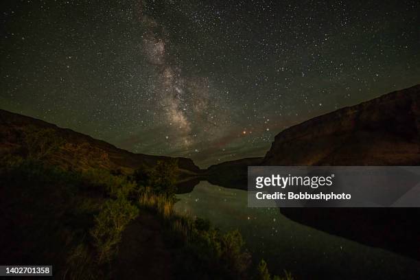 milky way over reservoir at snake river at the swan falls dam - nature reserve stock pictures, royalty-free photos & images