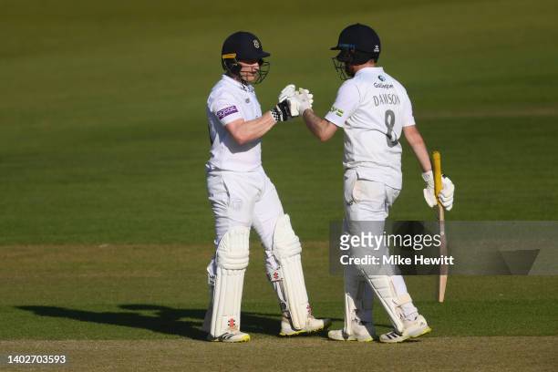 Ben Brown and Liam Dawson of Hampshire share in a 100 run partnership during the LV= Insurance County Championship match between Hampshire and...