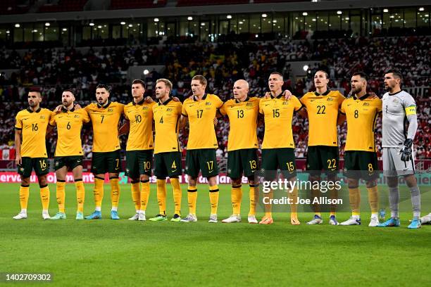 Australia stands for the national anthems the 2022 FIFA World Cup Playoff match between Australia Socceroos and Peru at Ahmad Bin Ali Stadium on June...