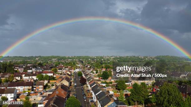 aerial view of rainbow over buildings in city,luton,united kingdom,uk - arco iris doble fotografías e imágenes de stock