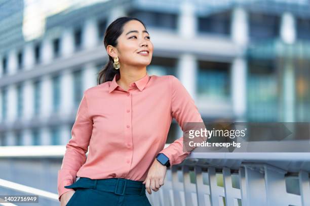 portrait of beautiful businesswoman in city - ponytail hairstyle stock pictures, royalty-free photos & images