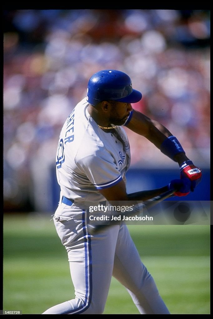 First baseman Joe Carter of the Toronto Blue Jays swings at the ball ...
