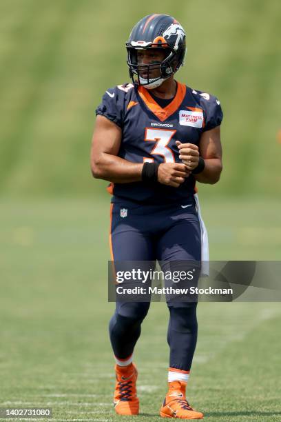 Quarterback Russell Wilson of the Denver Broncos attends their mandatory mini-camp at UCHealth Training Center on June 13, 2022 in Englewood,...