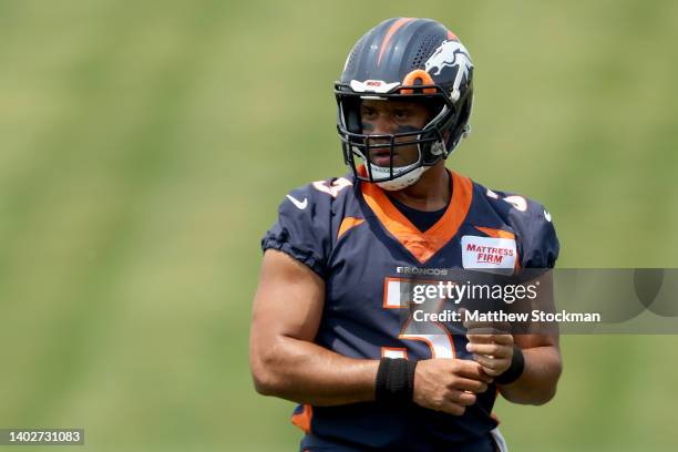 Quarterback Russell Wilson of the Denver Broncos attends their mandatory mini-camp at UCHealth Training Center on June 13, 2022 in Englewood,...