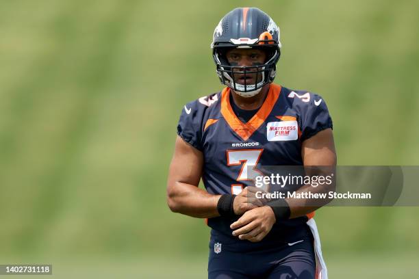 Quarterback Russell Wilson of the Denver Broncos attends their mandatory mini-camp at UCHealth Training Center on June 13, 2022 in Englewood,...