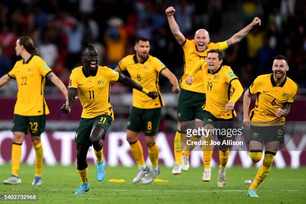 Australia celebrate after winning the game in penalty shootouts in the 2022 FIFA World Cup Playoff match between Australia Socceroos and Peru at...