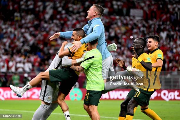 Australia celebrate after defeating Peru in the 2022 FIFA World Cup Playoff match between Australia Socceroos and Peru at Ahmad Bin Ali Stadium on...
