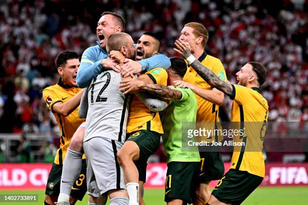 Australia celebrate after defeating Peru in the 2022 FIFA World Cup Playoff match between Australia Socceroos and Peru at Ahmad Bin Ali Stadium on...