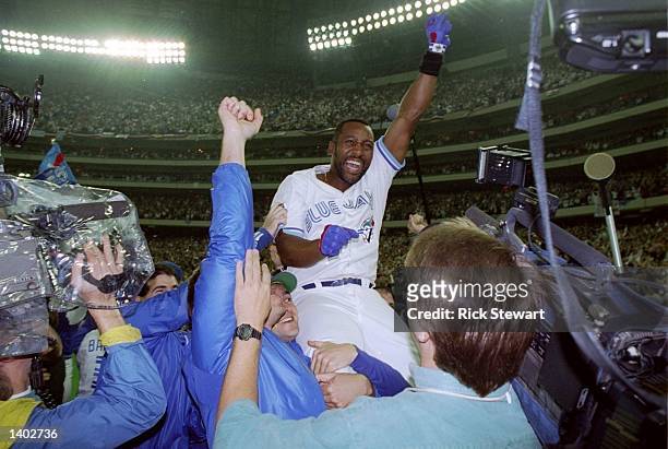 Firrst baseman Joe Carter of the Toronto Blue Jays celebrates after the World Series against the Philadelphia Phillies at the Toronto Sky Dome in...