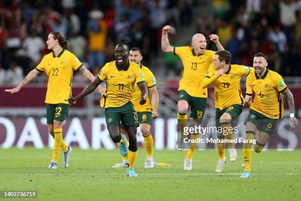Awer Mabil and team mates of Australia celebrate their sides victory after a penalty shoot out following the 2022 FIFA World Cup Playoff match...