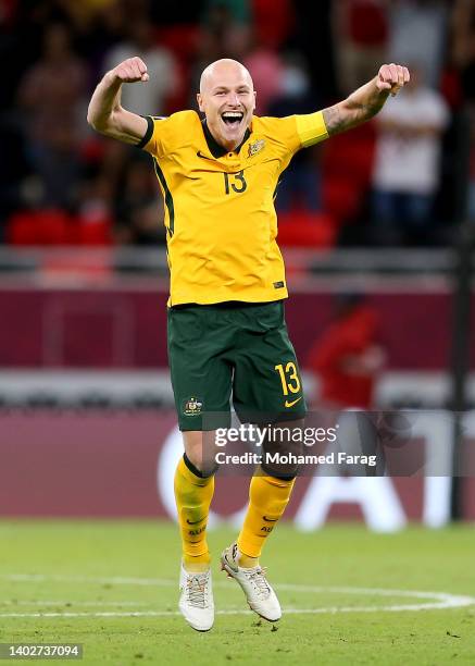 Aaron Mooy of Australia celebrates their sides victory after a penalty shoot out following the 2022 FIFA World Cup Playoff match between Australia...