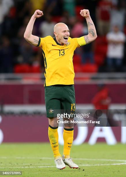 Aaron Mooy of Australia celebrates their sides victory after a penalty shoot out following the 2022 FIFA World Cup Playoff match between Australia...