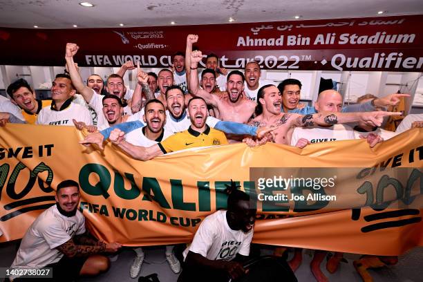 Australia celebrates their win over Peru in the changing room following the 2022 FIFA World Cup Playoff match between Australia Socceroos and Peru at...