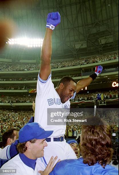 Firrst baseman Joe Carter of the Toronto Blue Jays celebrates after the World Series against the Philadelphia Phillies at the Toronto Sky Dome in...