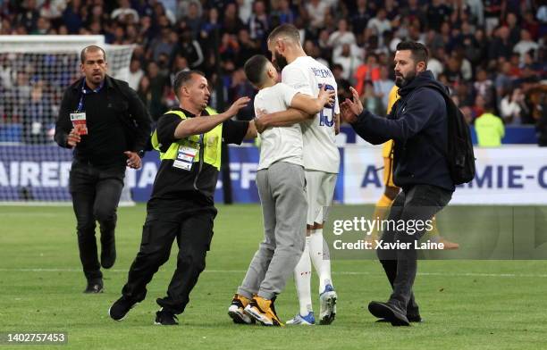 Karim Benzema of Team France react with a streaker after the UEFA Nations League League A Group 1 match between France and Croatia at Stade de France...