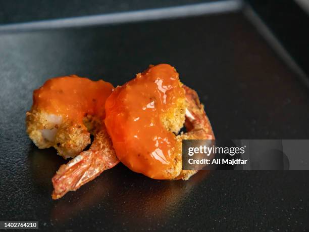 air fried crispy shrimp with buffalo sauce - buffalo chicken stock pictures, royalty-free photos & images