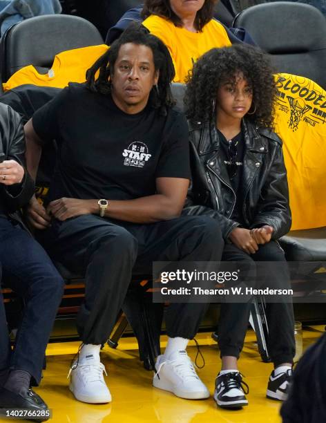 Rapper Jay-Z and his daughter Blue Ivy Carter look on during the second quarter of Game Five of the 2022 NBA Finals between the Boston Celtics and...