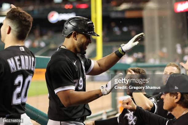 Jose Abreu of the Chicago White Sox celebrates his ninth inning two run home run with teammates while playing the Detroit Tigers at Comerica Park on...
