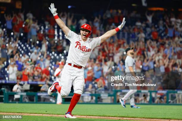 Rhys Hoskins of the Philadelphia Phillies celebrates after hitting a walk-off RBI double to defeat the Miami Marlins 3-2 at Citizens Bank Park on...