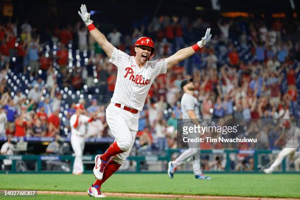 Rhys Hoskins of the Philadelphia Phillies celebrates after hitting a walk-off RBI double to defeat the Miami Marlins 3-2 at Citizens Bank Park on...