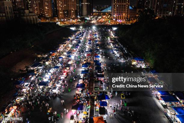 Aerial view of people enjoying food at a night fair on June 13, 2022 in Nanning, Guangxi Zhuang Autonomous Region of China.