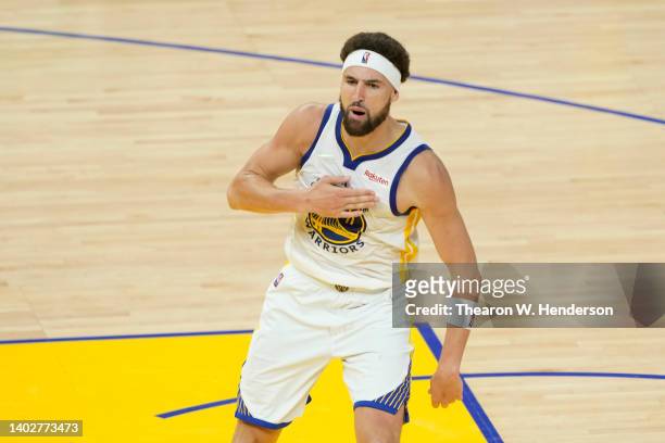 Klay Thompson of the Golden State Warriors celebrates a three point basket during the fourth quarter against the Boston Celtics in Game Five of the...