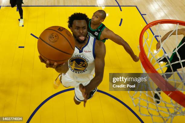 Andrew Wiggins of the Golden State Warriors drives to the basket against Al Horford of the Boston Celtics during the first half in Game Five of the...