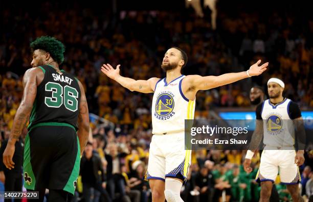 Stephen Curry of the Golden State Warriors reacts to a basket during the fourth quarter against the Boston Celtics in Game Five of the 2022 NBA...