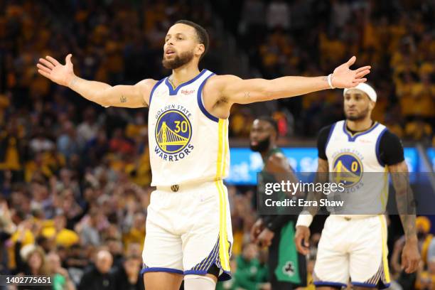 Stephen Curry of the Golden State Warriors reacts to a basket during the fourth quarter against the Boston Celtics in Game Five of the 2022 NBA...