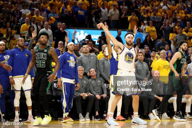 Klay Thompson of the Golden State Warriors shoots a three point basket against Marcus Smart of the Boston Celtics during the fourth quarter in Game...