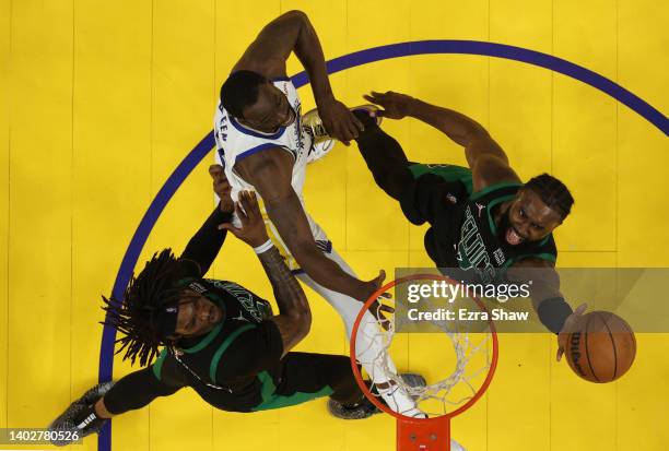 Jaylen Brown of the Boston Celtics drives to the basket against Draymond Green of the Golden State Warriors during the third quarter in Game Five of...