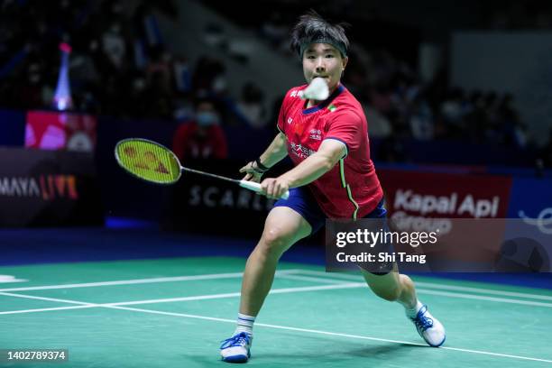 He Bingjiao of China competes in the Women's Singles First Round match against Pusarla V. Sindhu of India on day one of the Indonesia Open at Istora...