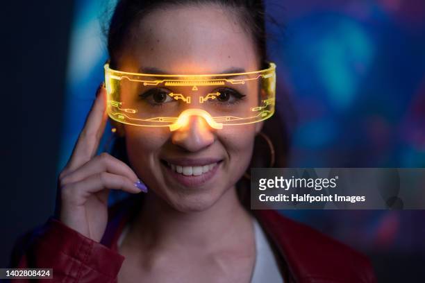 portrait of futuristic young woman in vr environment with smart glasses. - smart glasses eyewear foto e immagini stock