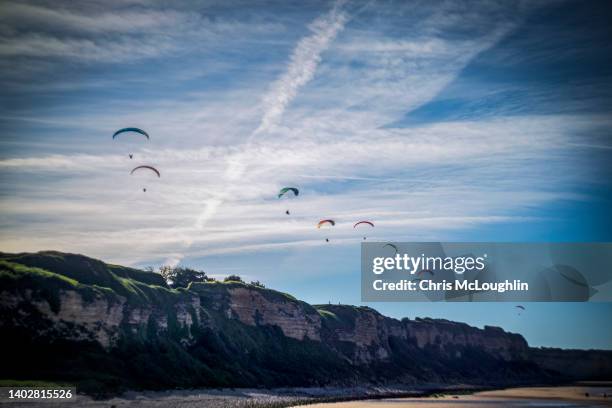 para gliders over omaha beach on the normandy coast in france - water glide stockfoto's en -beelden