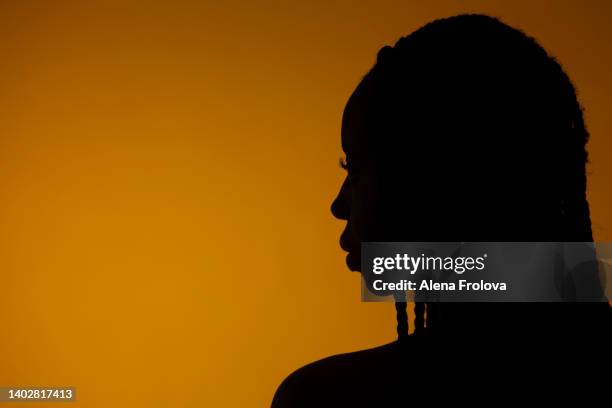 portrait of beautiful young afro woman - black woman silhouette stock pictures, royalty-free photos & images