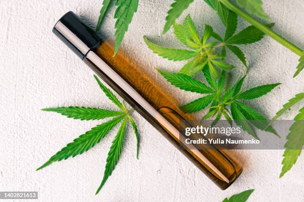 cannabis herb and leaves with oil extracts. cbd products. - cbd oil stock pictures, royalty-free photos & images