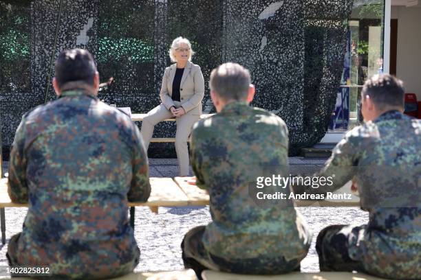 German Defense Minister Christine Lambrecht speaks to members of the Bundeswehr, division of the Cyber and Information Space Command , as she visits...
