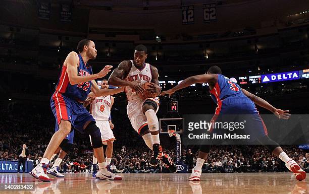 Iman Shumpert of the New York Knicks in action against Tayshaun Prince and Rodney Stuckey of the Detroit Pistons on January 31, 2012 at Madison...