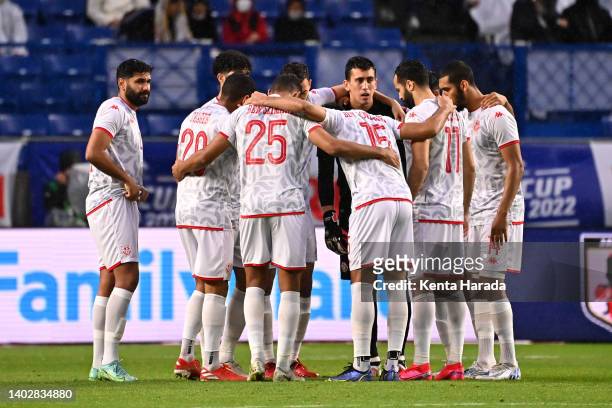 Tunisia players huddle prior to the international friendly match between Japan and Tunisia at Panasonic Stadium Suita on June 14, 2022 in Suita,...