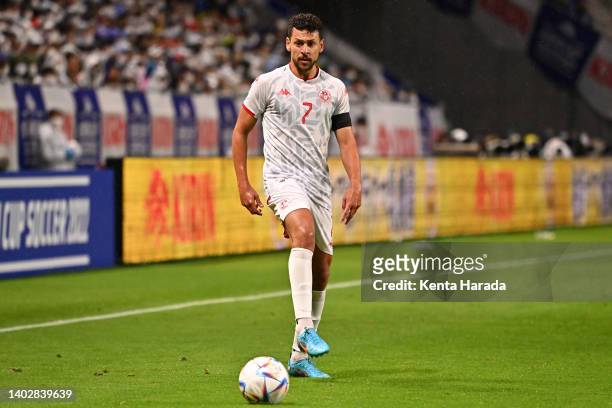 Youssef Msakni of Tunisia in action during the international friendly match between Japan and Tunisia at Panasonic Stadium Suita on June 14, 2022 in...