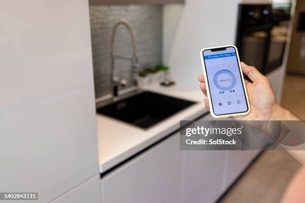 phone thermostat - smart kitchen stock pictures, royalty-free photos & images