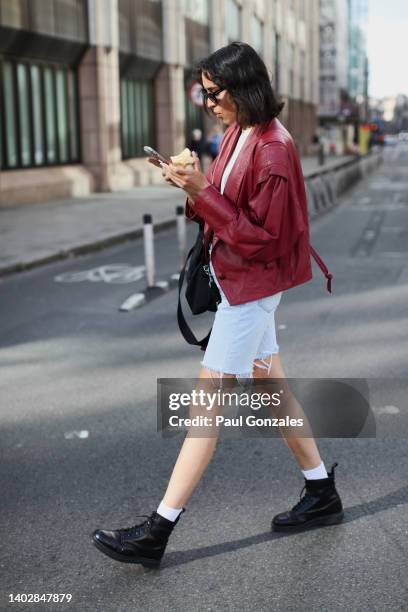 Model is seen wearing a Vintage Red Leather Jacket with a Pair of Cut-Off Denim Shorts. At AGR during London Fashion Week on June 11, 2022 in London,...