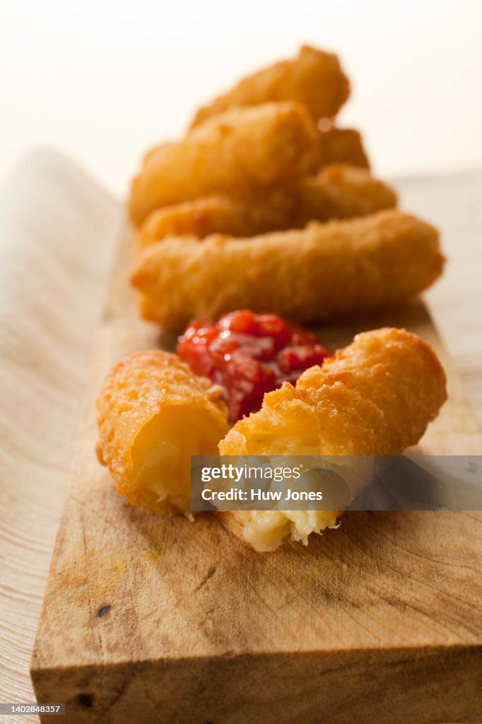 Close up deep fried cheese and onion sticks