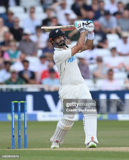 New Zealand batsman Daryl Mitchell straight drives for a six off Stuart Broad during day five of the Second Test Match between England and New...